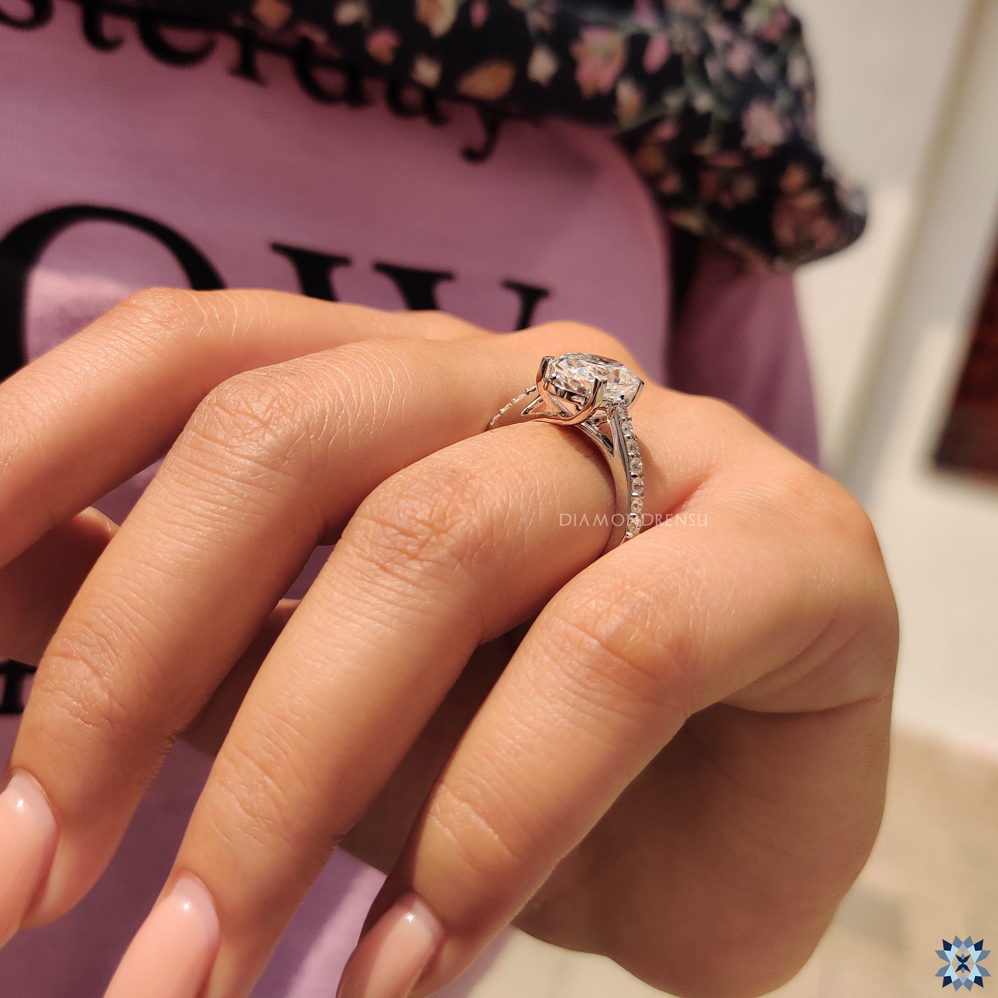 Moissanite ring in round cut engagement ring setting
