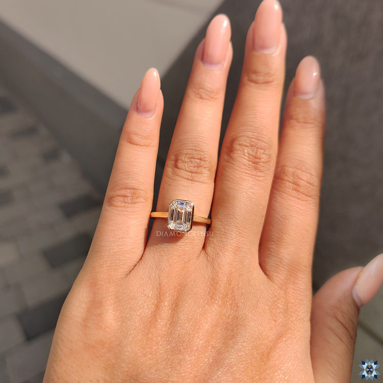 Yellow gold ring in bezel set engagement ring style
