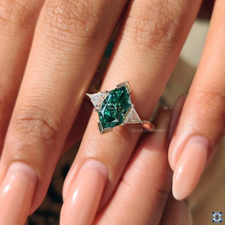 Custom engagement ring featuring Dutch marquise and triangle side stones.
