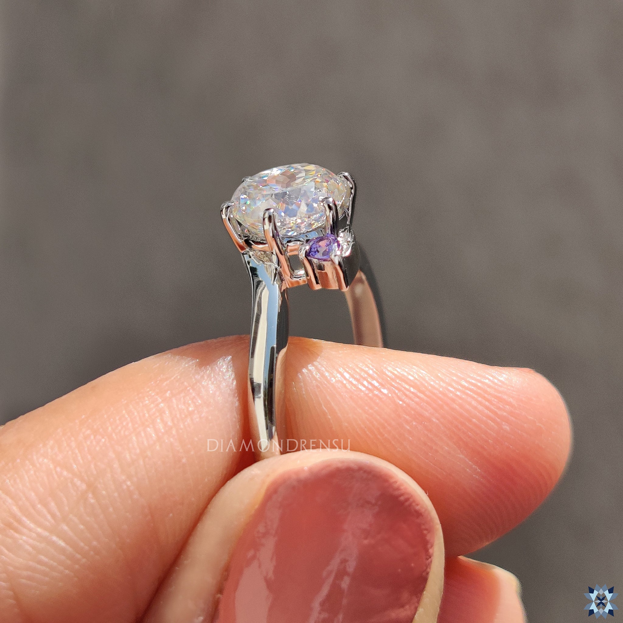 Moissanite ring UK featuring Portuguese cut centre and rose cut sides.
