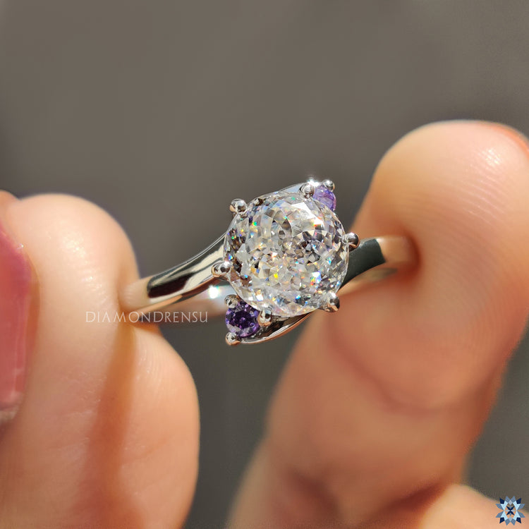 Handmade ring featuring a 6 prong Portuguese cut moissanite in white gold.
