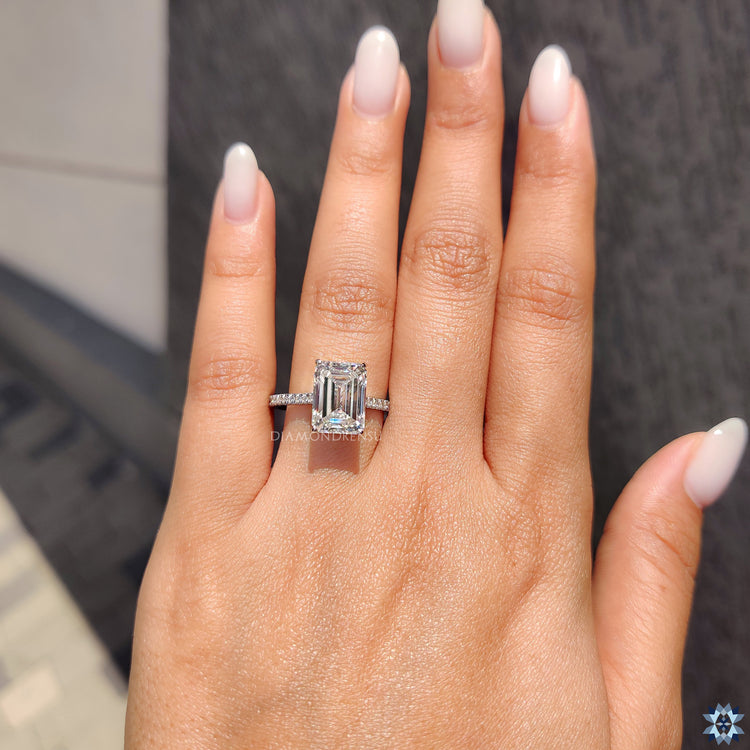 Buy moissanite ring with a custom 4 prong setting and white gold finish.

