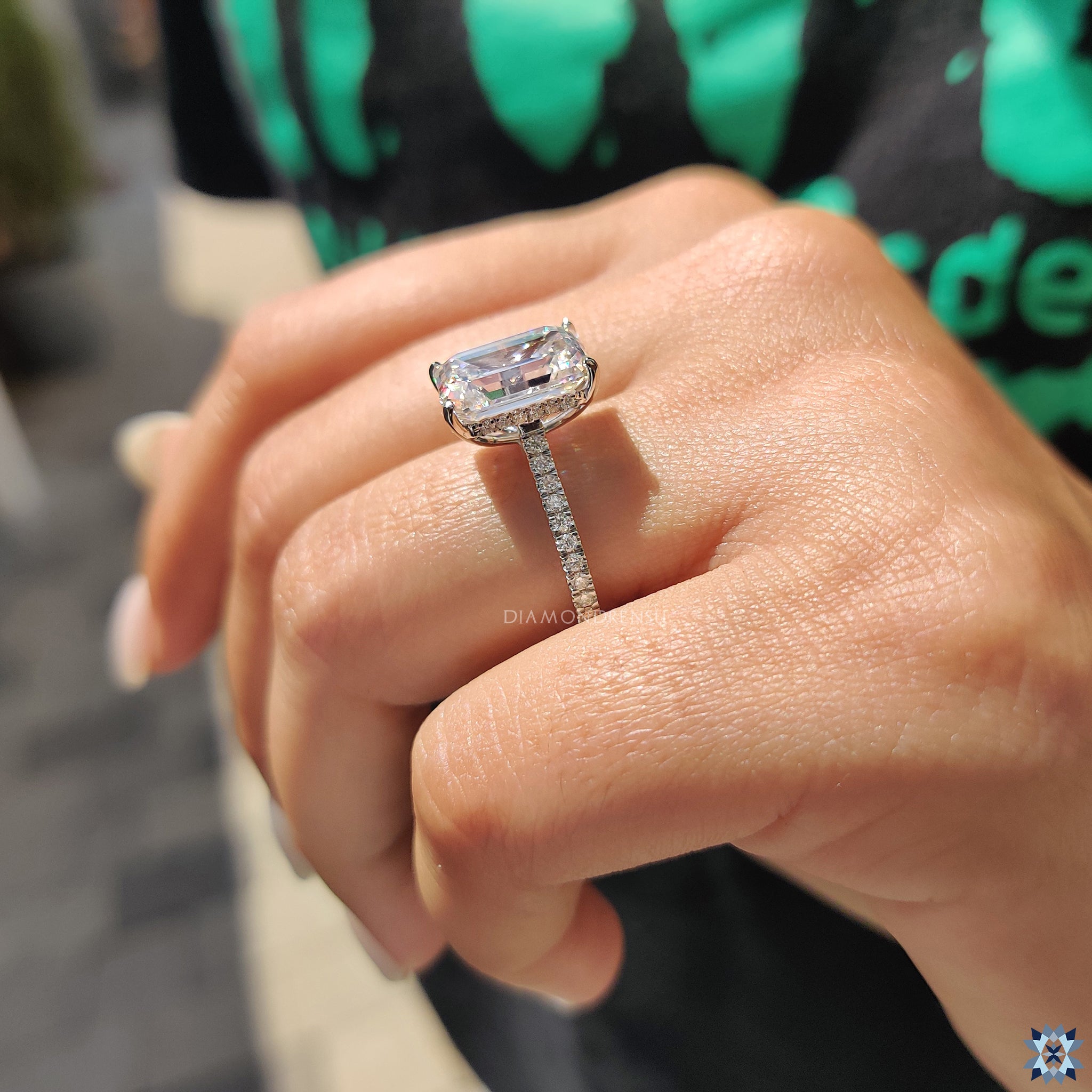 Handmade jewellery with emerald cut moissanite and gold band.

