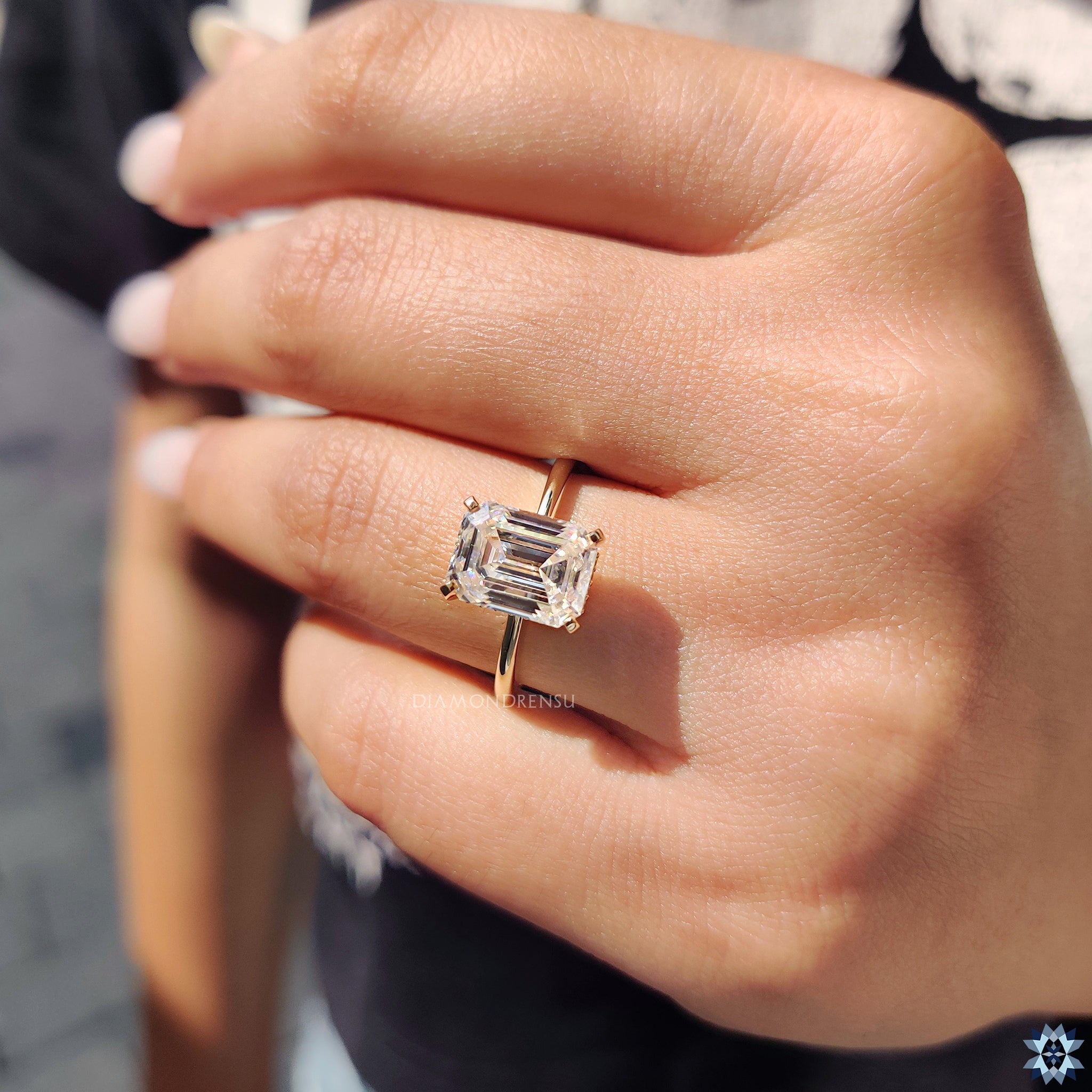 Moissanite engagement ring crafted in a solitaire style with hidden halo detail.
