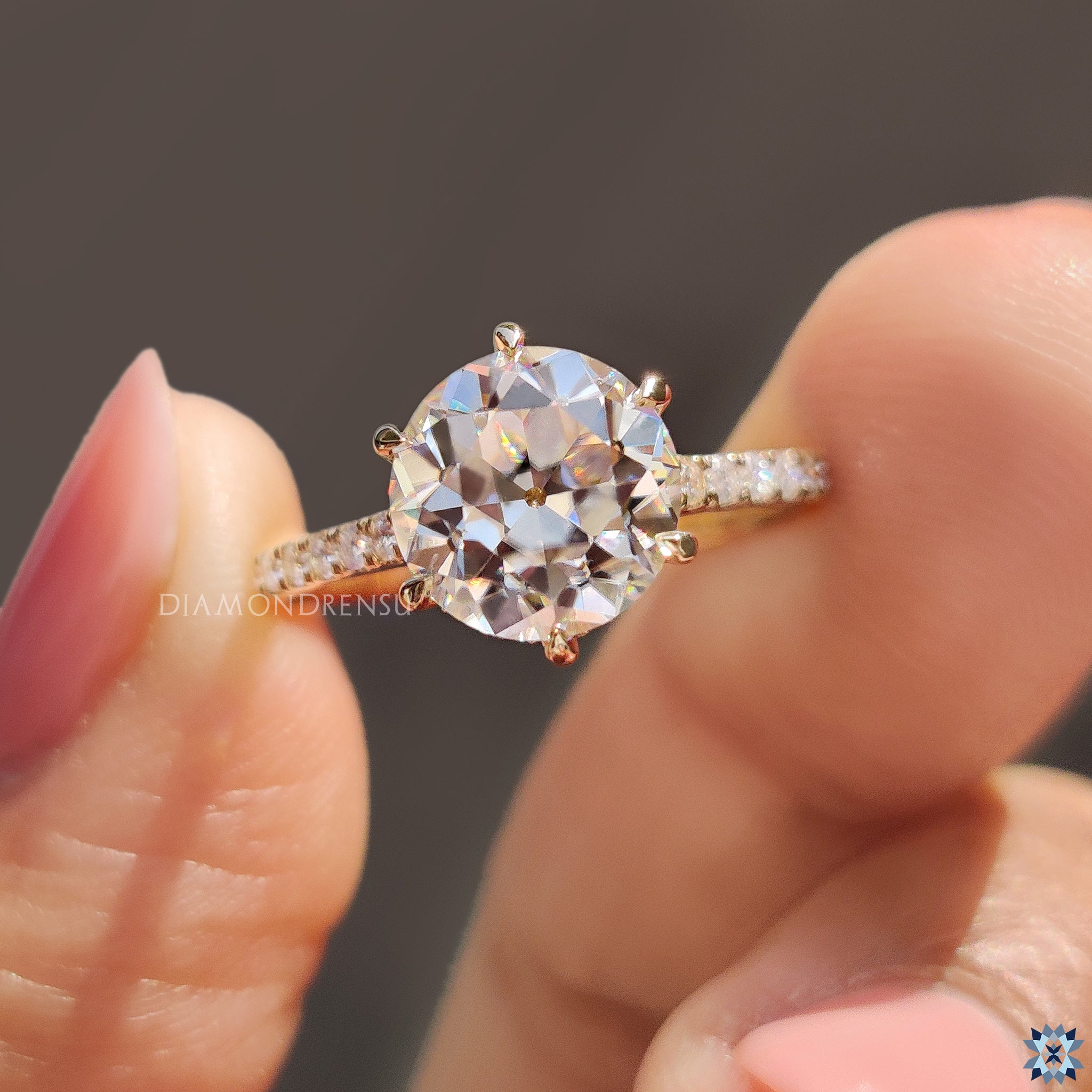 Round old European cut ring with pave and 6 prong claw setting.
