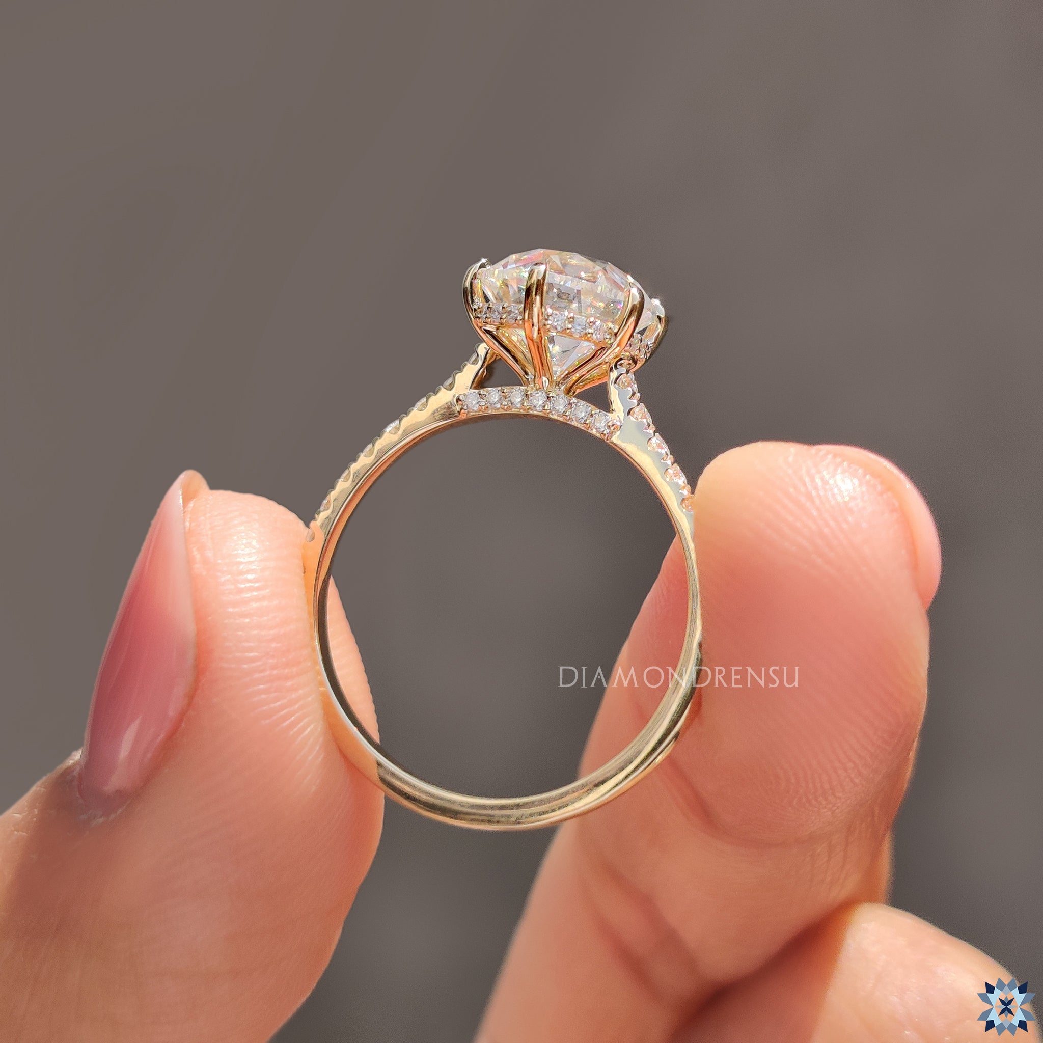 Diamondrensu UK engagement ring with old European cut and bridge accents.
