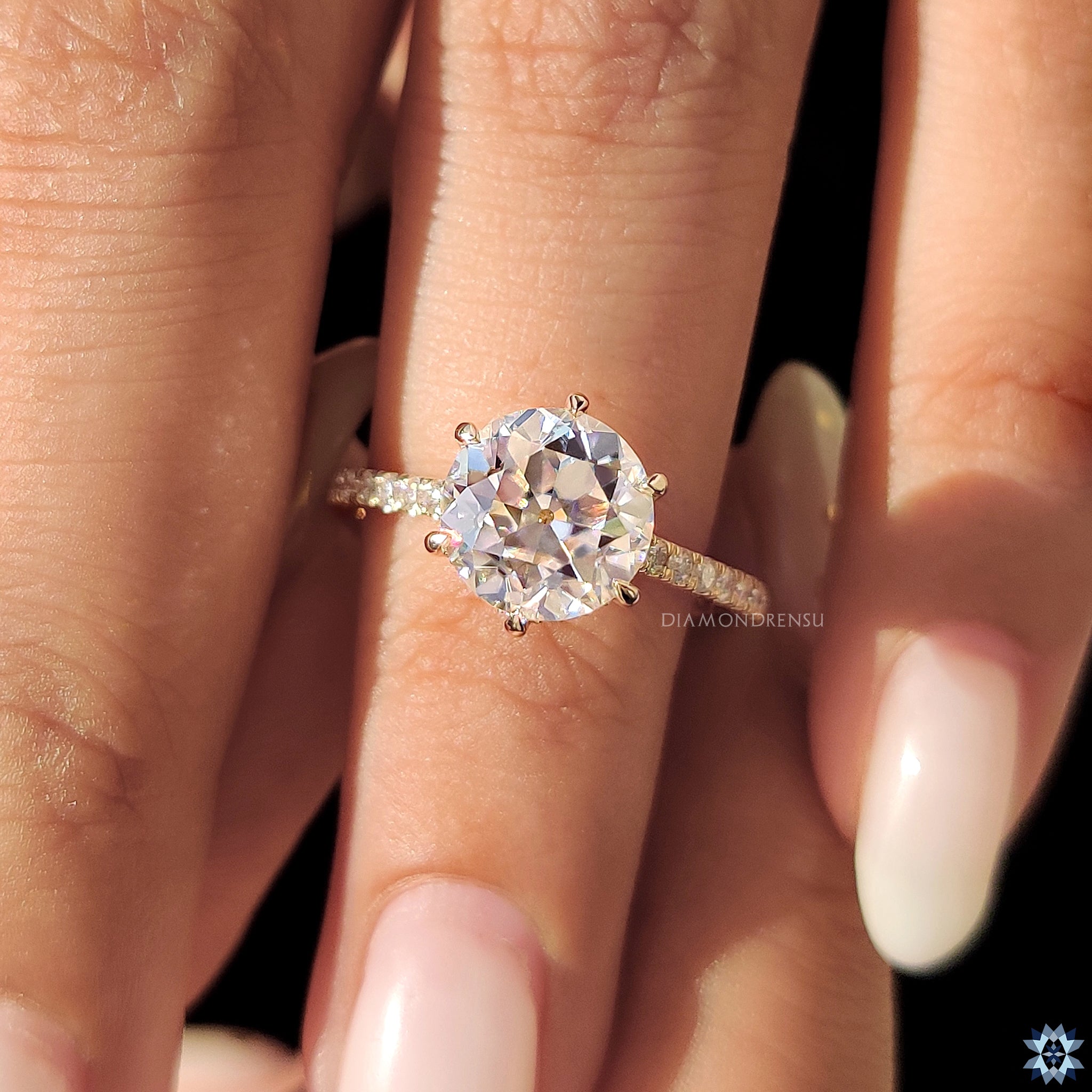 Handmade jewellery featuring round old European cut in pave setting.
