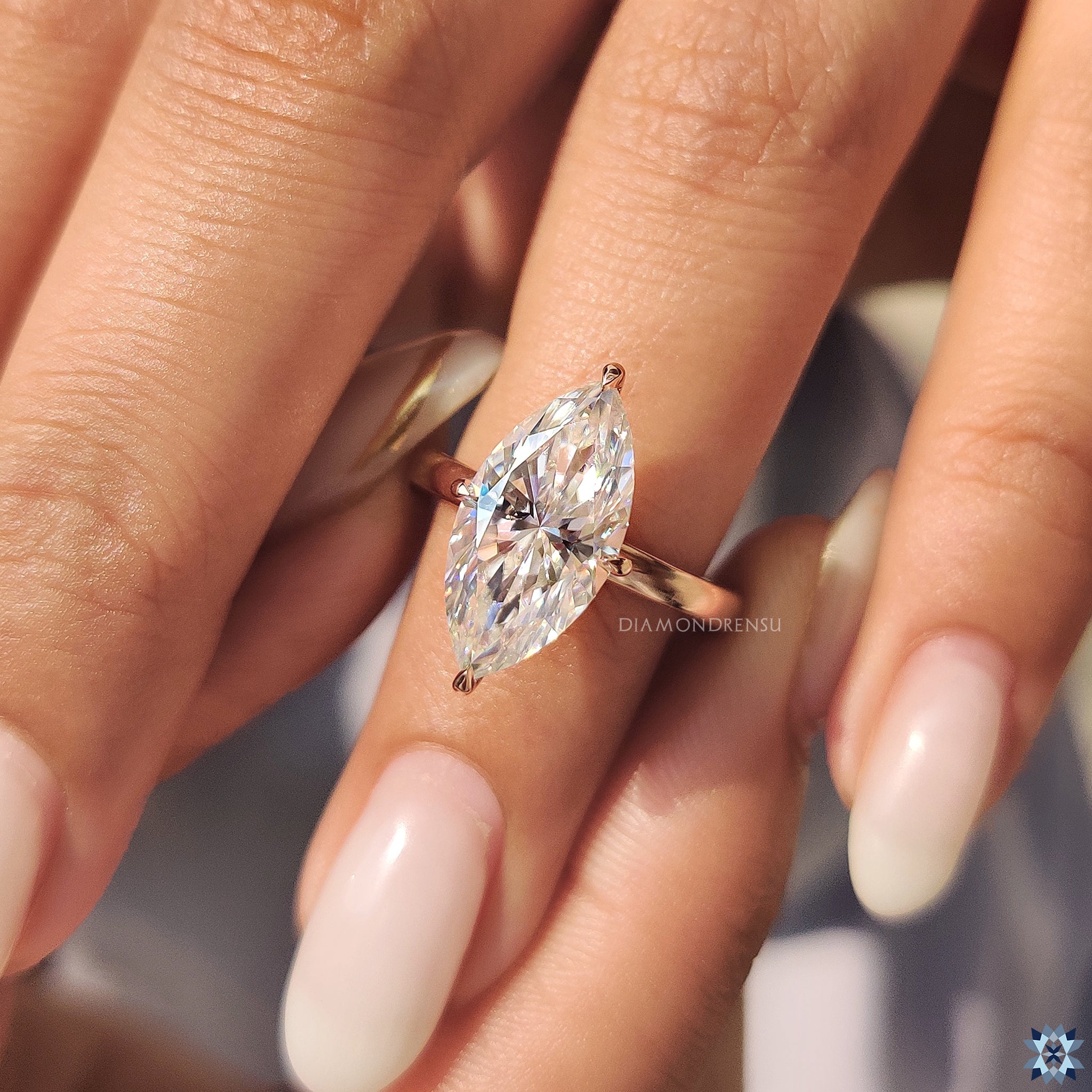 Marquise cut moissanite engagement ring in rose gold ring
