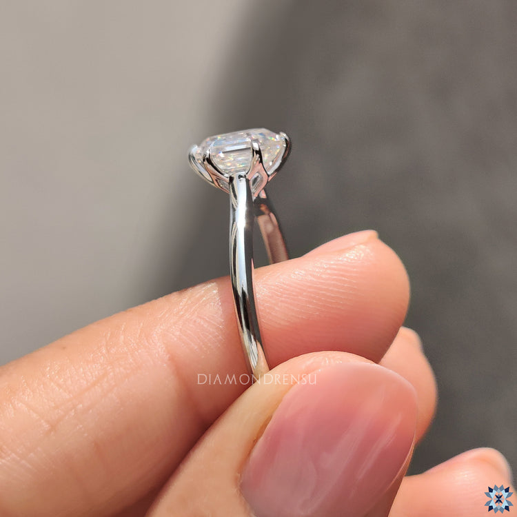 White gold ring designed with a hexagon moissanite and handcrafted finish.
