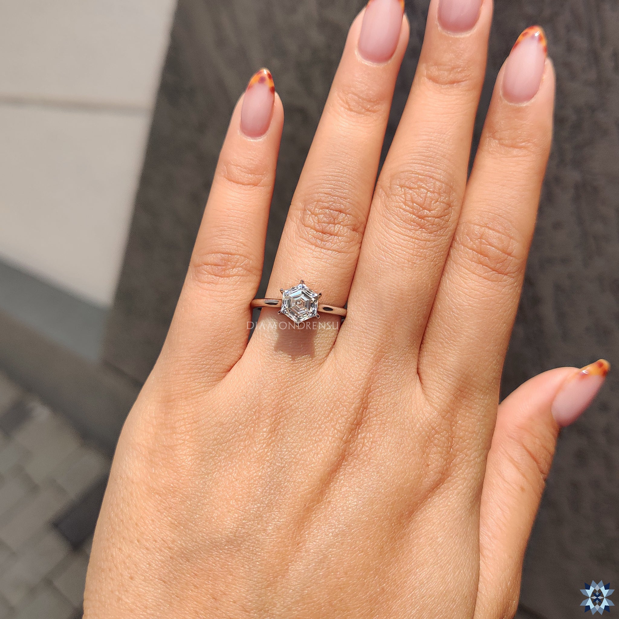 Cathedral setting moissanite engagement ring in a sleek white gold band.
