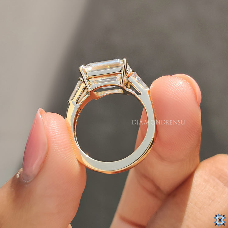 Moissanite for an engagement ring styled with East-West modern layout.
