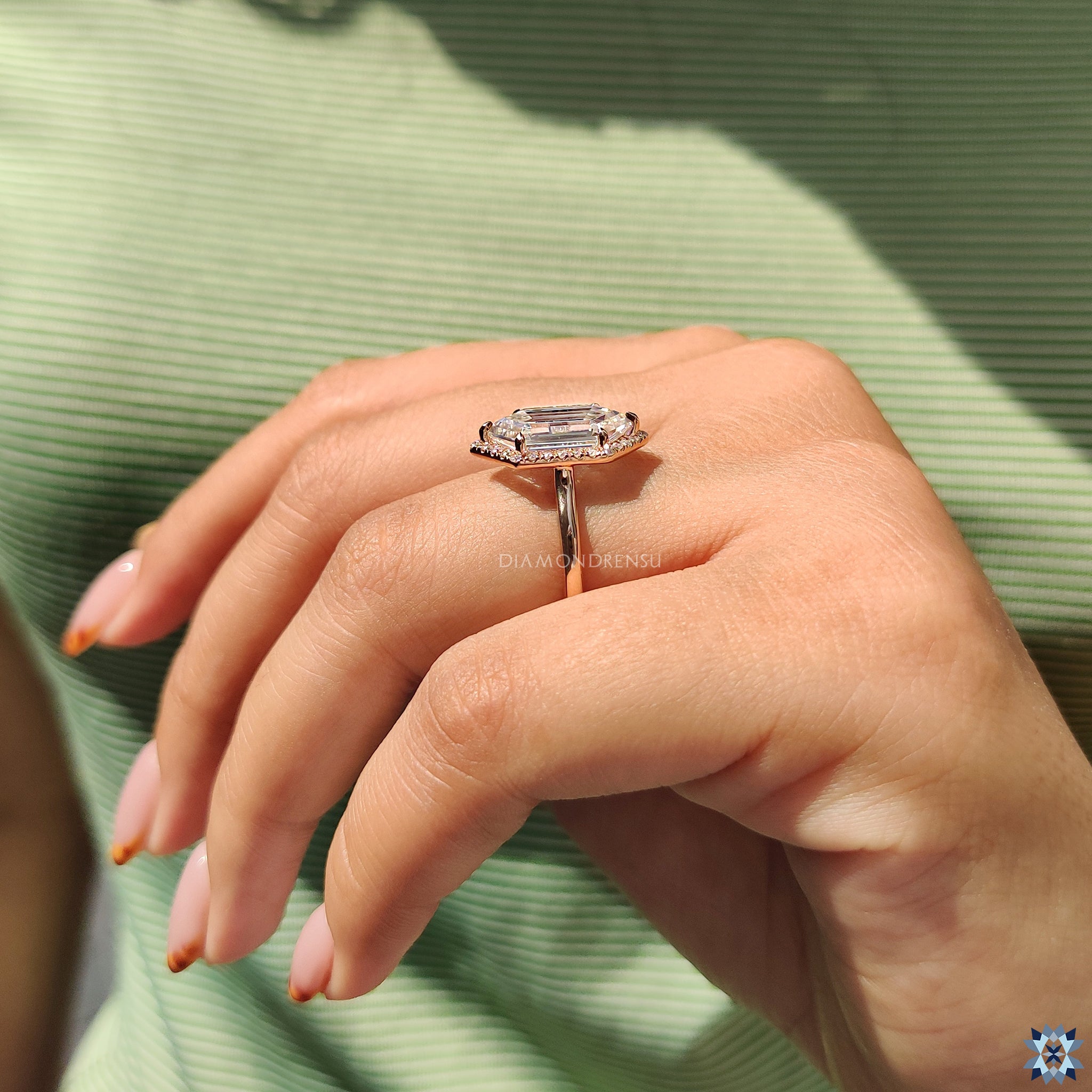 Diamondrensu UK engagement ring designed in rose gold with halo style.
