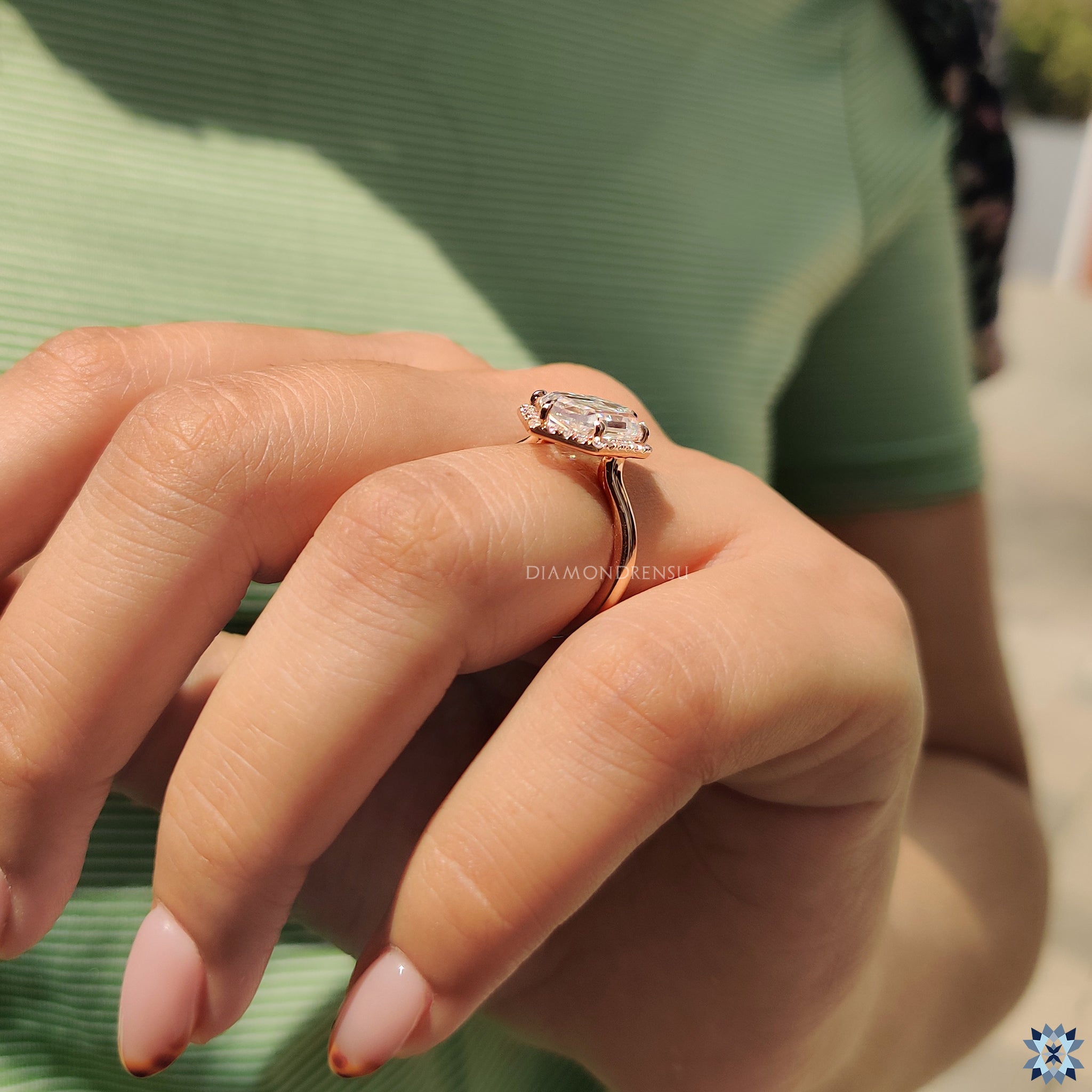 Rose gold moissanite ring with a handcrafted elongated hexagon stone.
