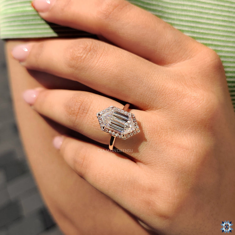 Moissanite ring UK made with unique hexagon shape and halo border.
