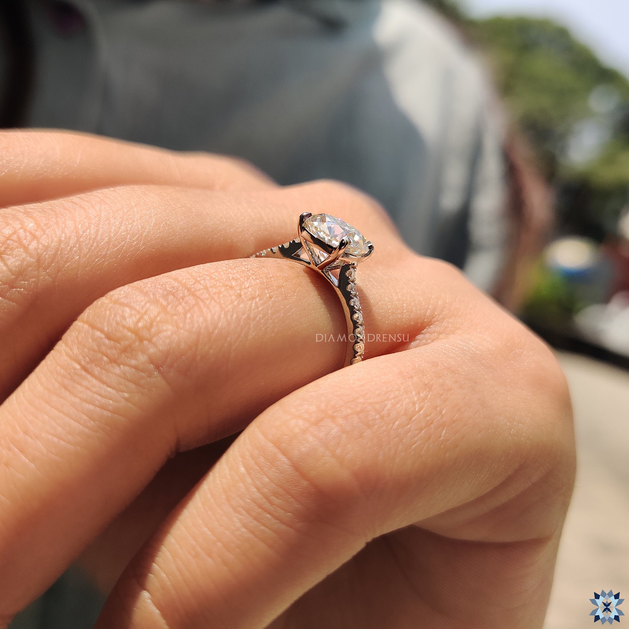 UK engagement ring with round cut moissanite and white gold.
