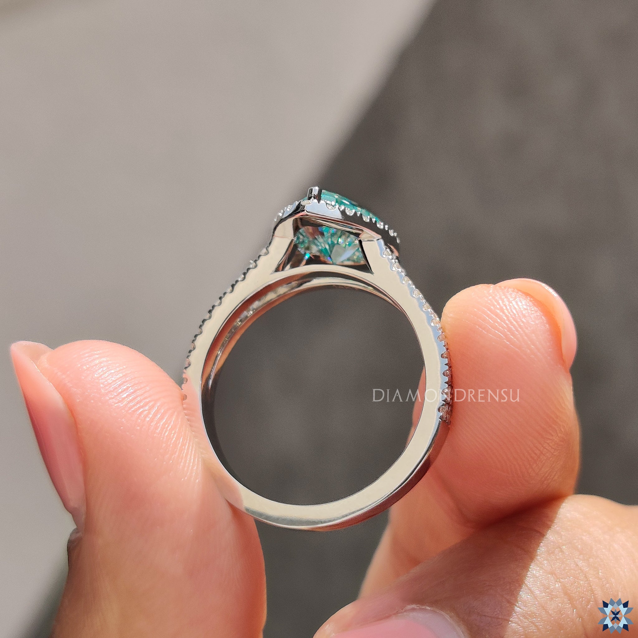 Split shank pave band with pear moissanite in custom engagement ring.
