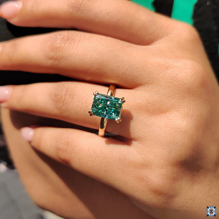 Moissanite for engagement ring with radiant cut and unique setting.
