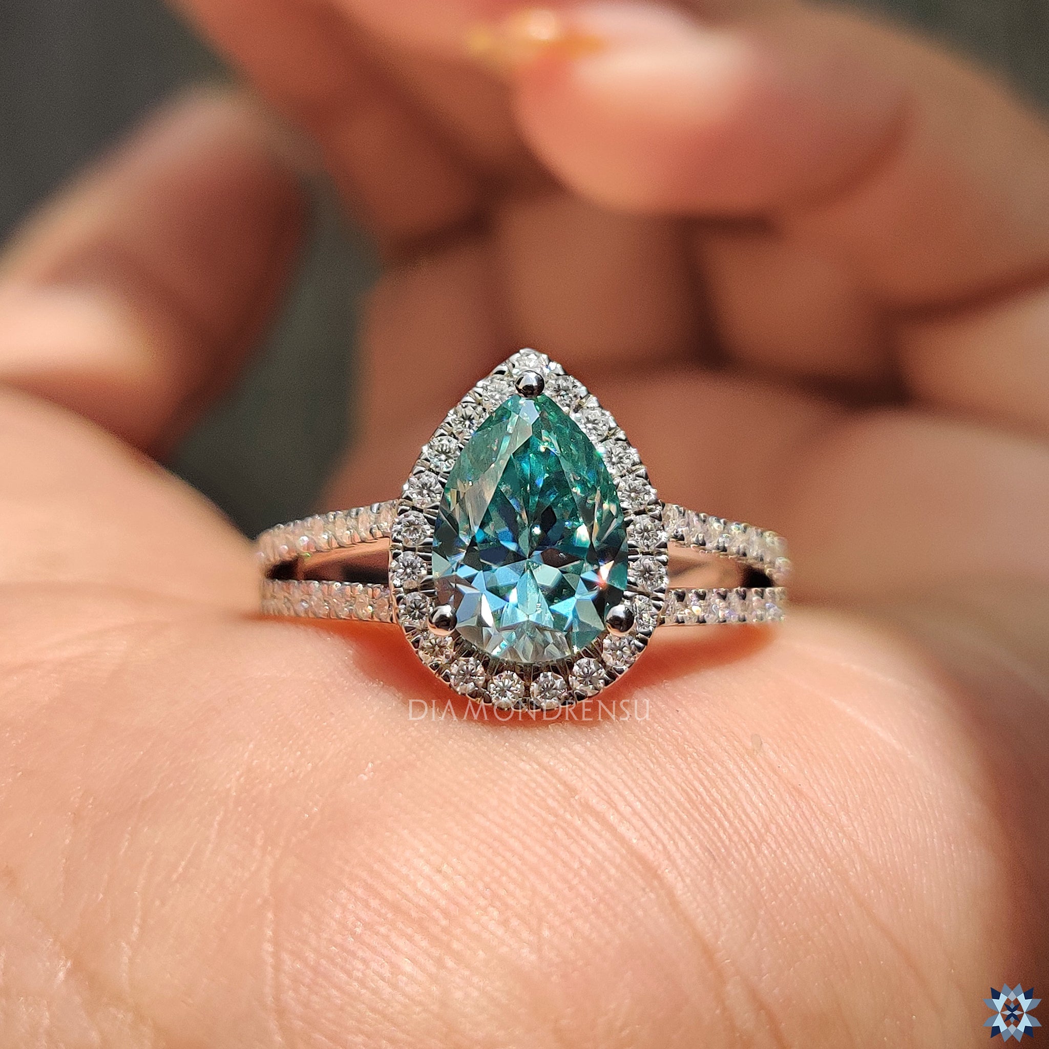 Handmade ring with pear cut moissanite and white gold band.
