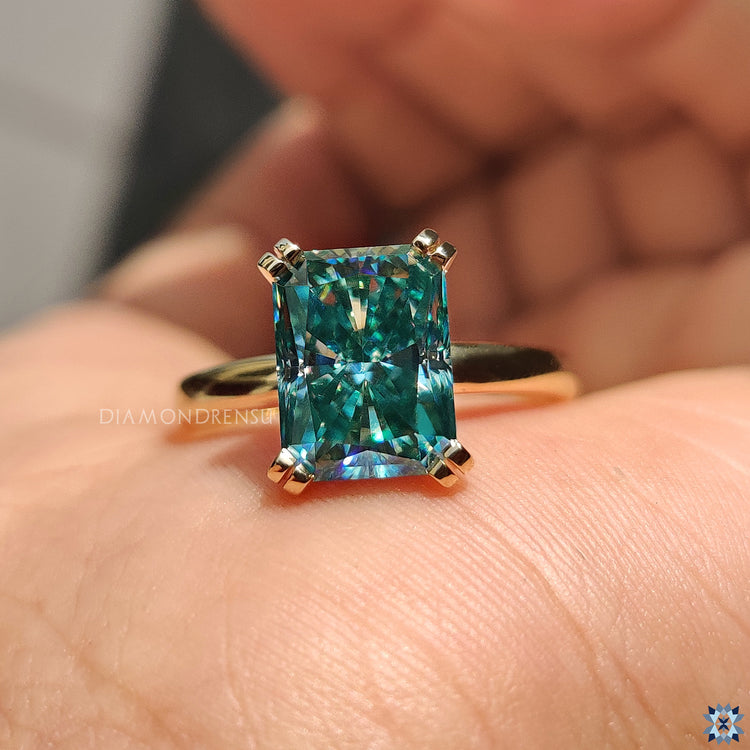 Handmade jewellery featuring radiant cut moissanite and double tab prongs.
