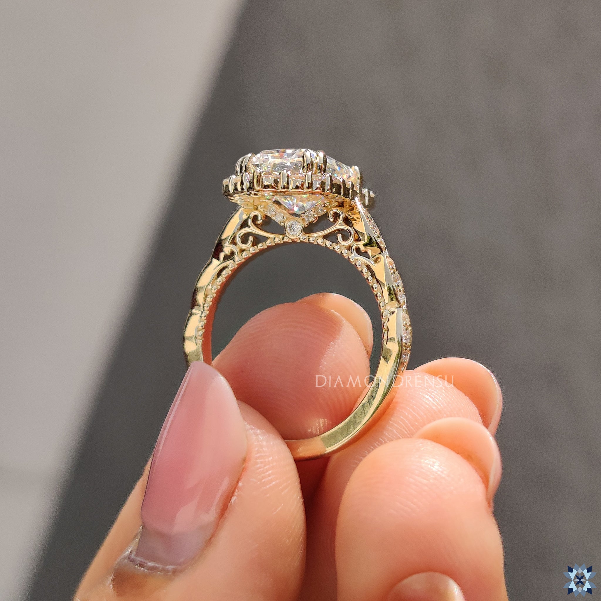 Handmade radiant cut engagement ring with round prongs and elegant vintage finish.
