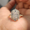 Radiant halo engagement ring with vintage milgrain detailing and yellow gold band.
