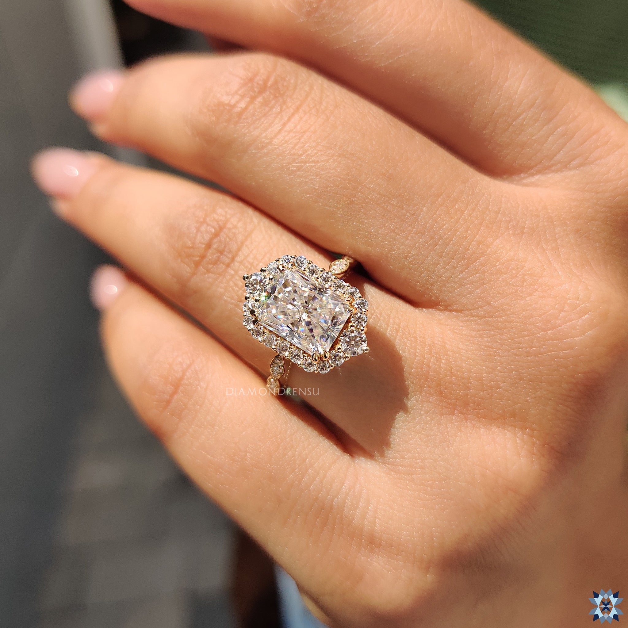 Diamondrensu UK yellow gold radiant moissanite ring with round cut pave band.
