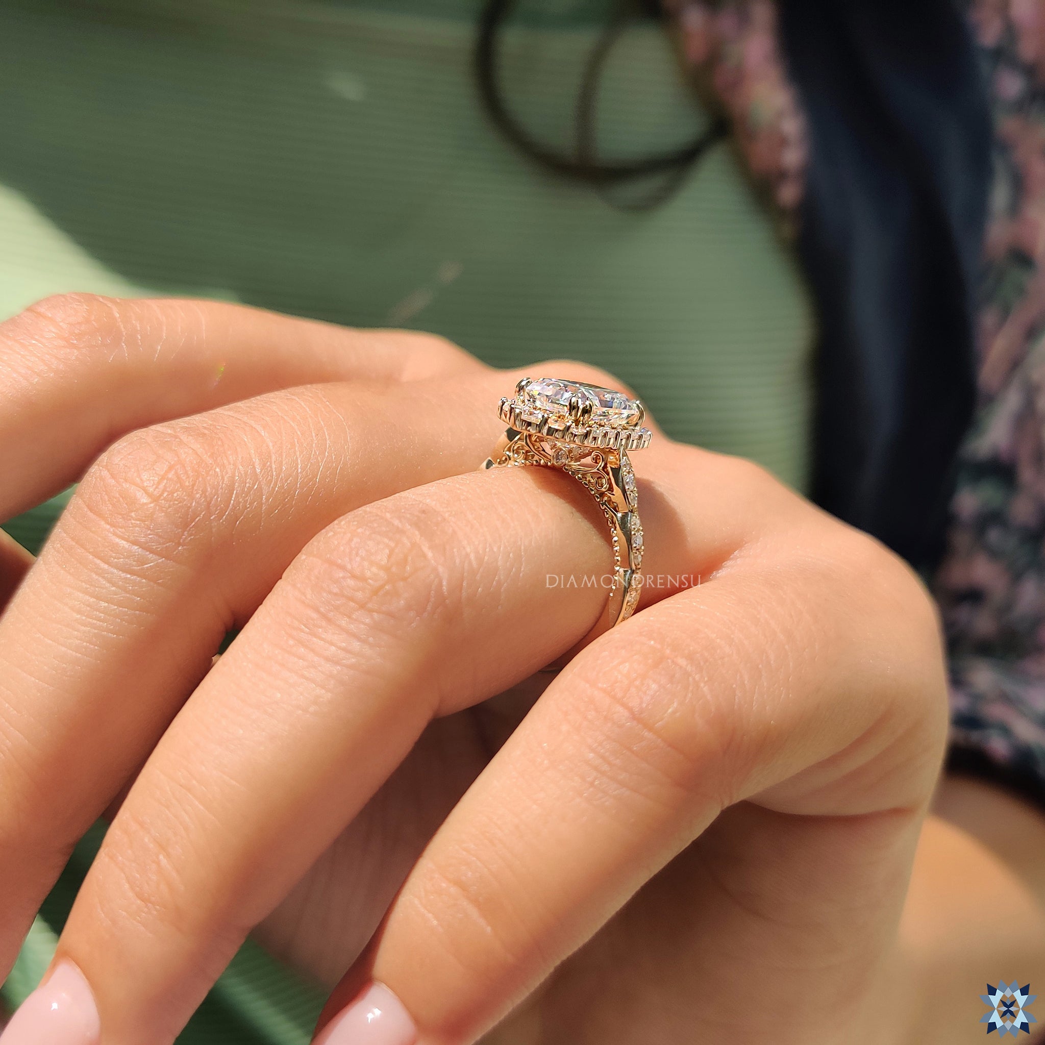 Round cut halo engagement ring with milgrain details in yellow gold setting.
