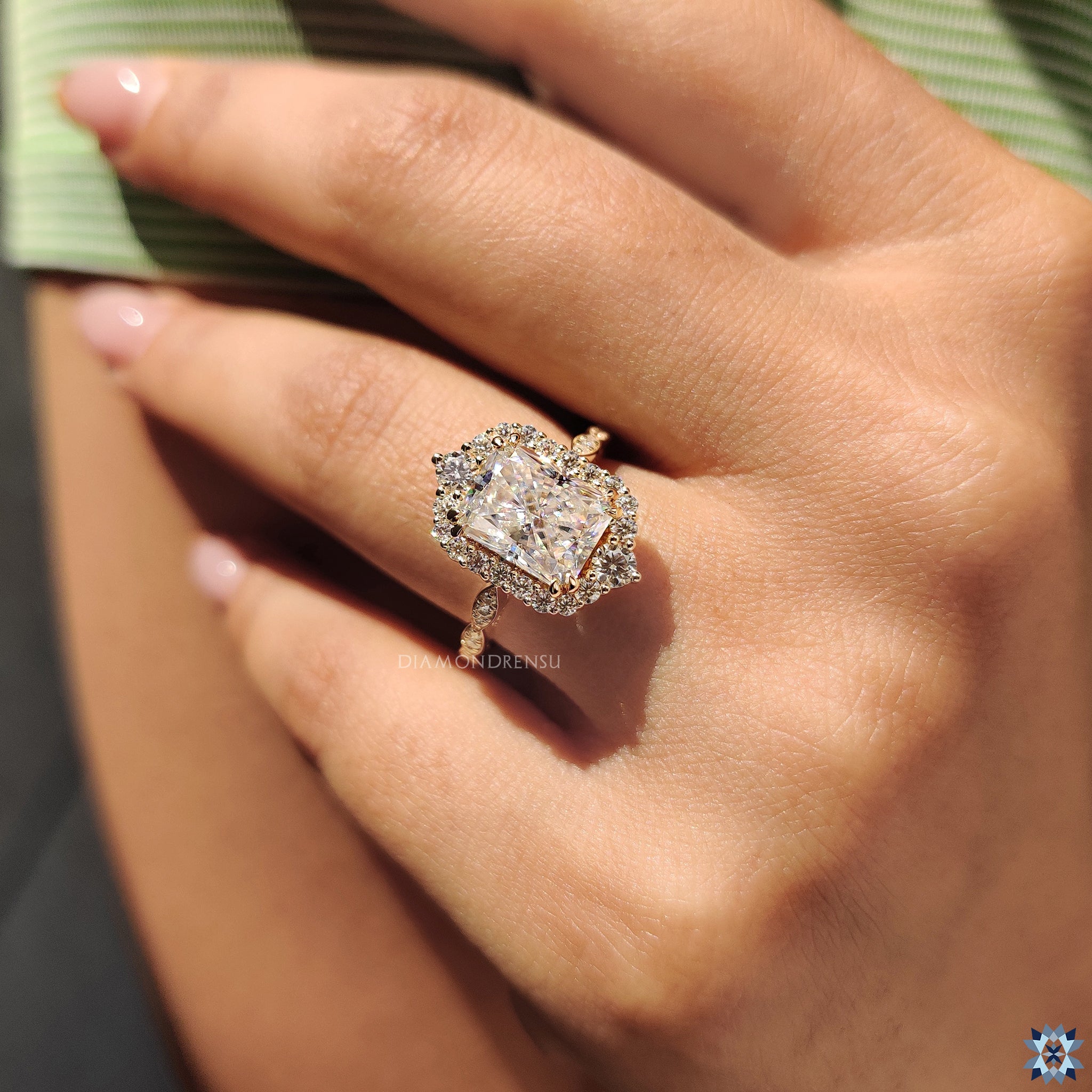 Round prong setting and radiant cut moissanite in handmade engagement ring.
