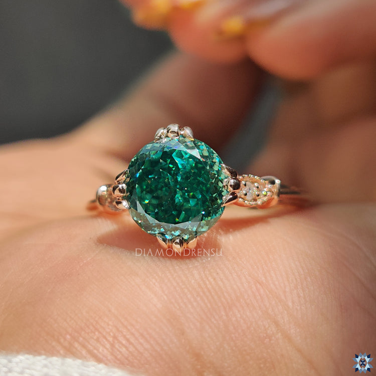 Fishtail prong setting on rose gold moissanite ring.
