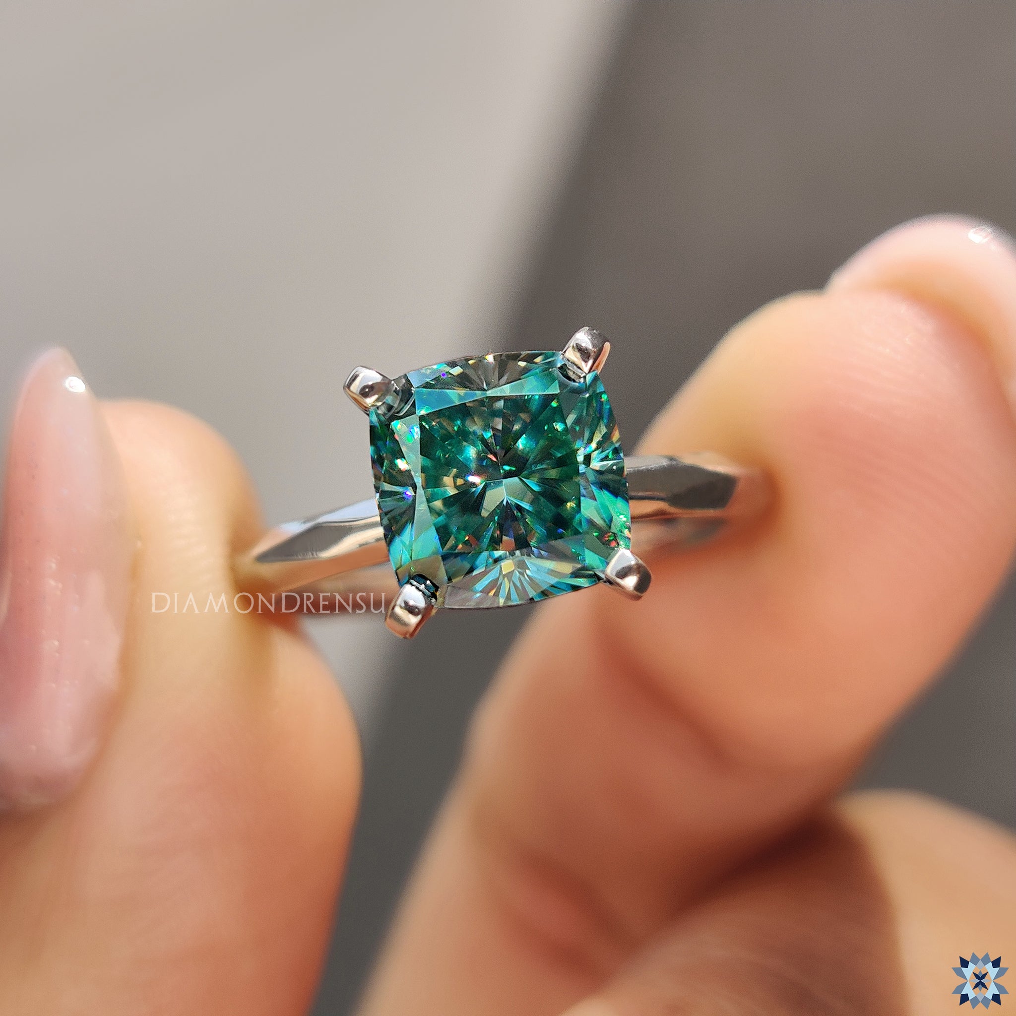 Hammer finish cushion moissanite ring in solitaire setting from Diamondrensu UK.
