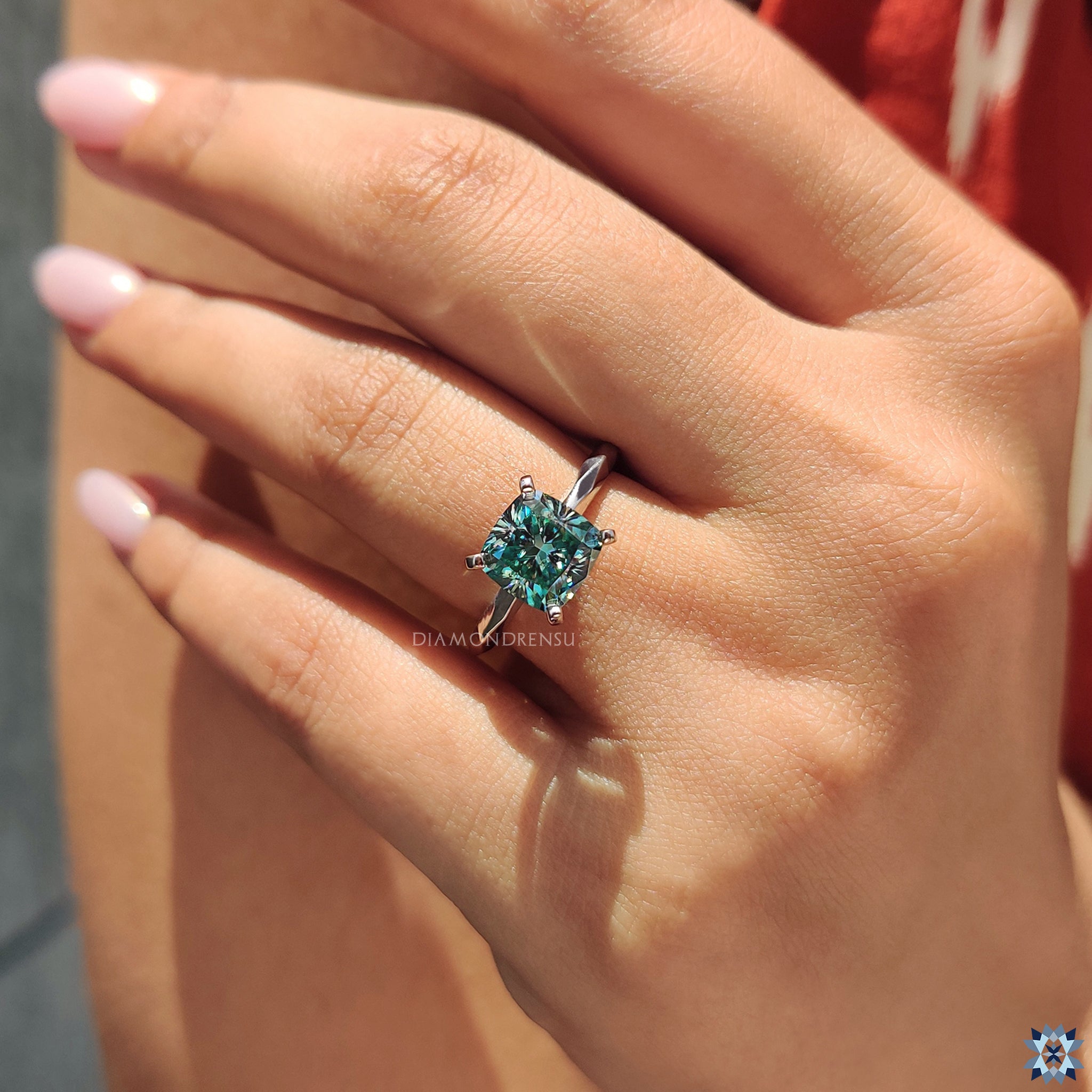 UK handmade jewelry ring featuring cushion cut cyan blue moissanite.
