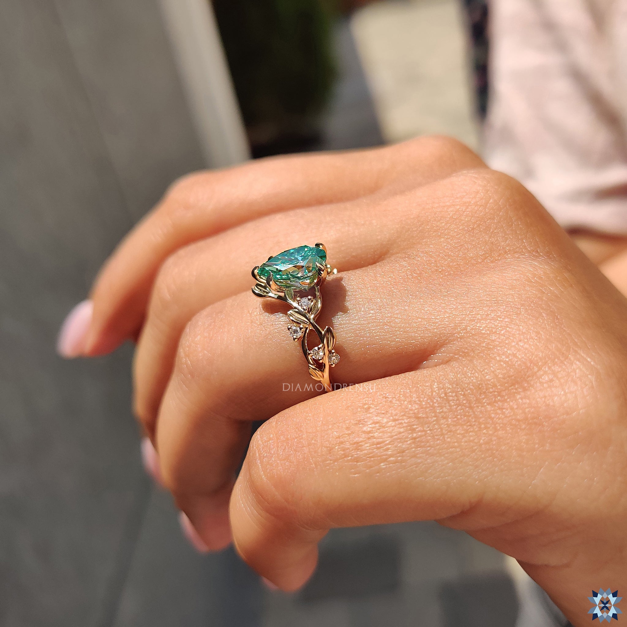 Buy engagement ring in yellow gold featuring a 5 claw prong and side round stones.
