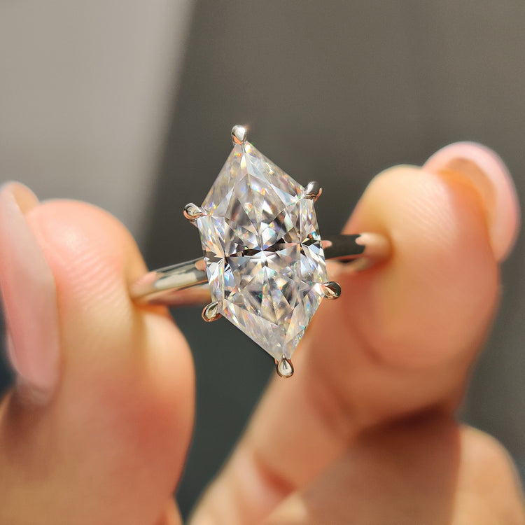 Dutch marquise Moissanite engagement ring with hidden halo and solitaire setting in white gold.
