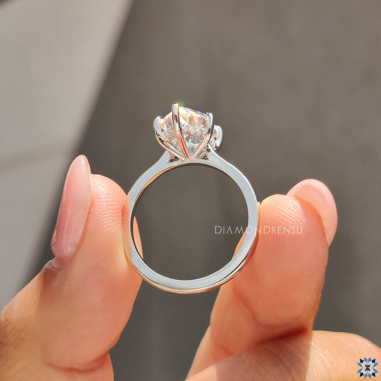 Diamondrensu UK engagement ring with hidden halo design and marquise cut Moissanite.
