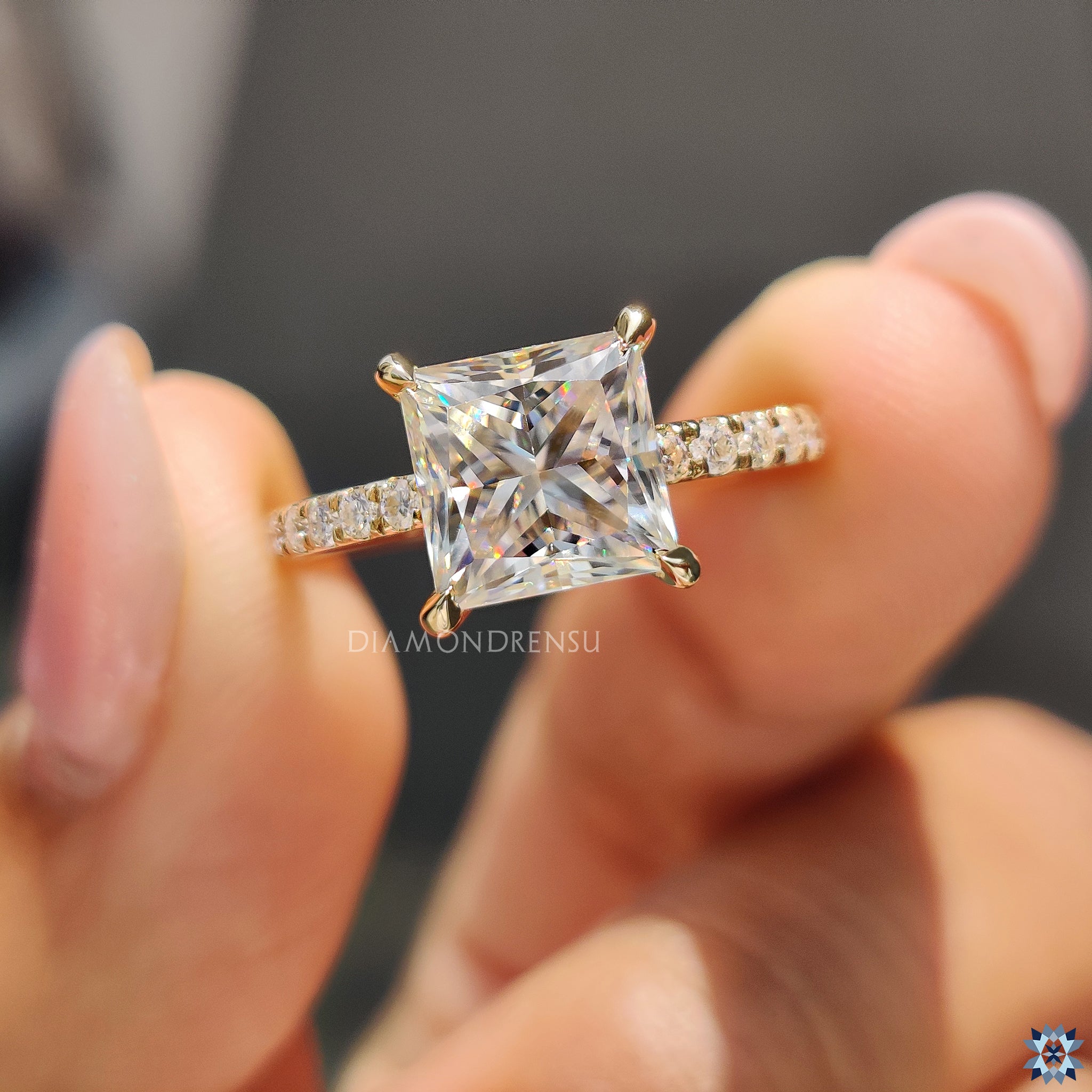 Handmade UK engagement ring with princess cut Moissanite and gold pave band.

