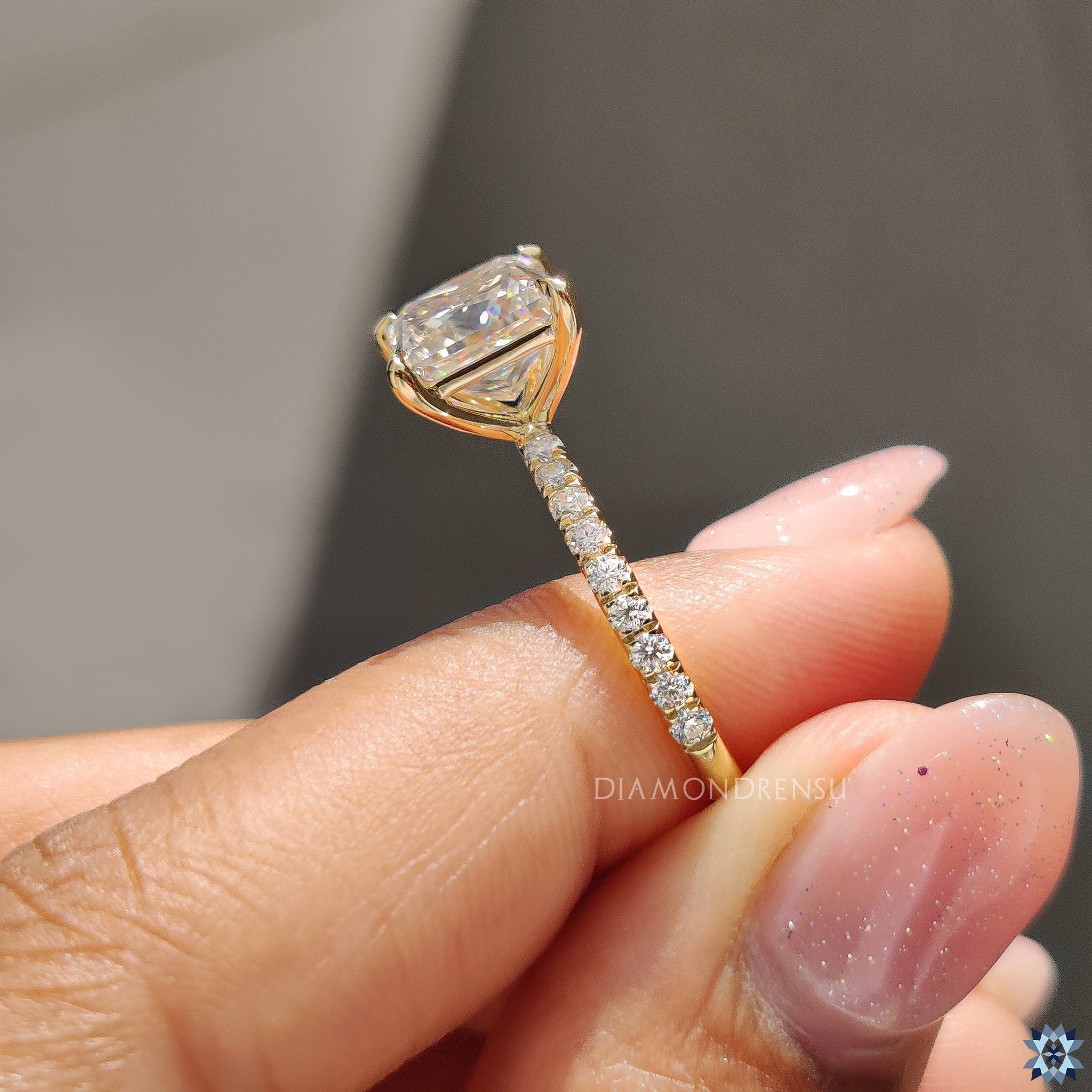 Handmade jewelry with princess cut Moissanite and 4 claw prong in gold.
