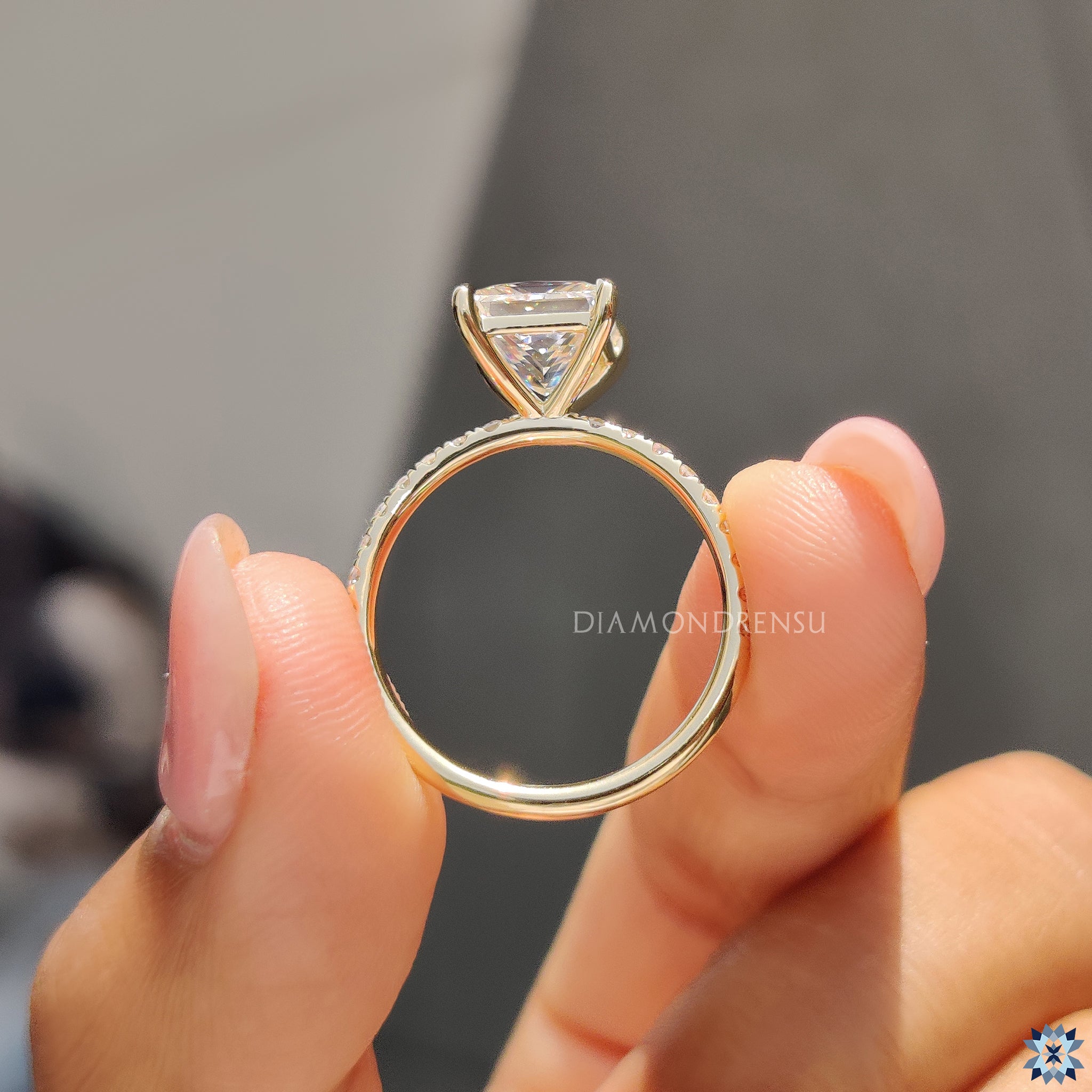 Diamondrensu UK engagement ring with pave band and princess cut Moissanite.
