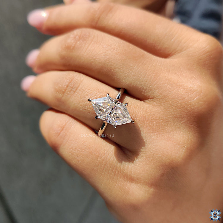Handmade Dutch marquise Moissanite ring with elegant hidden halo and claw prongs.
