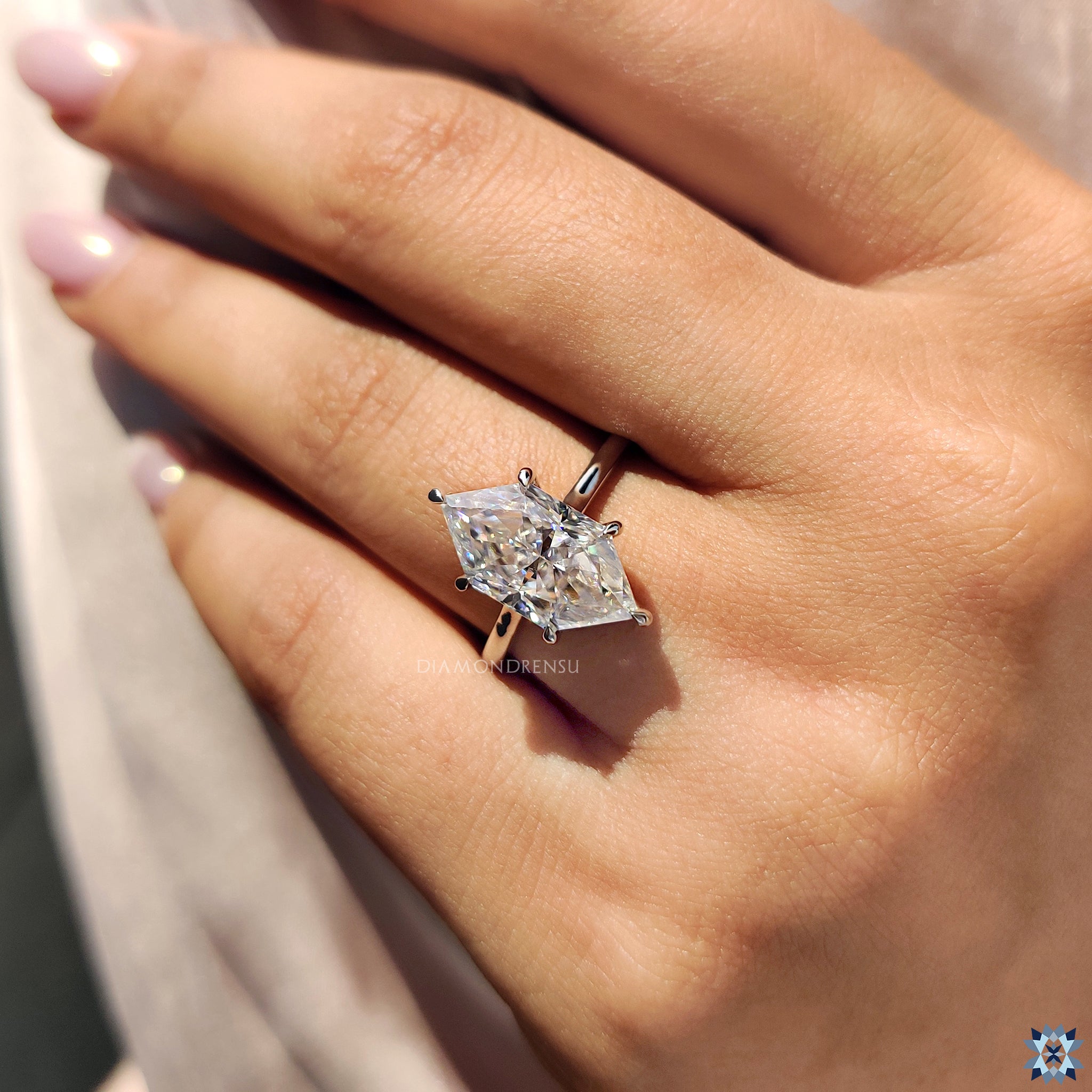 Dutch marquise engagement ring with hidden halo and classic 6 claw prong setting.
