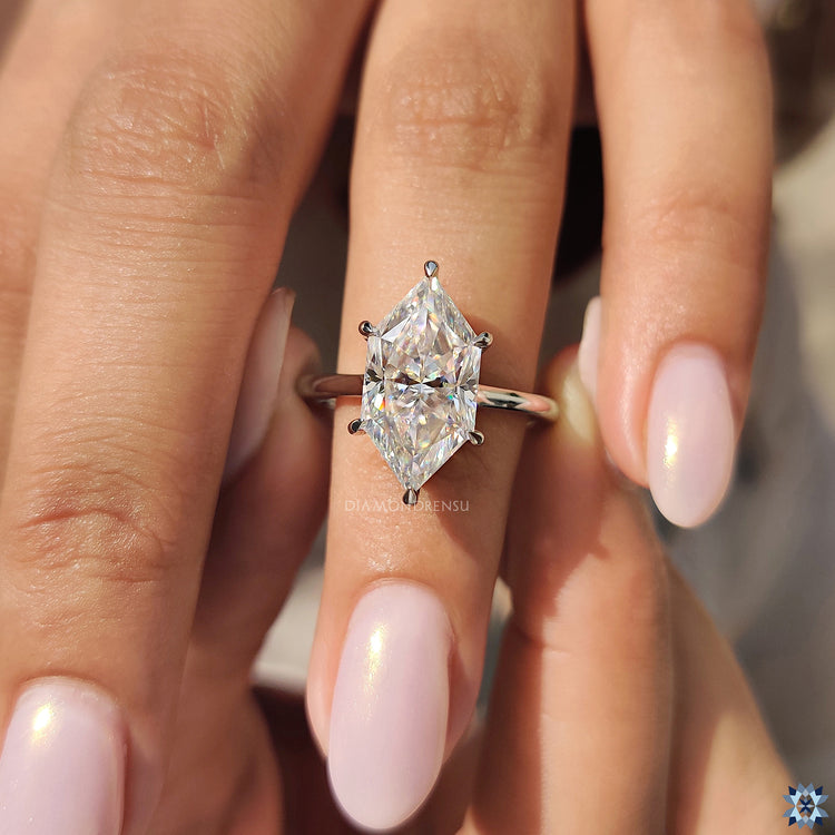 White gold solitaire ring with hidden halo round setting and Dutch marquise Moissanite.
