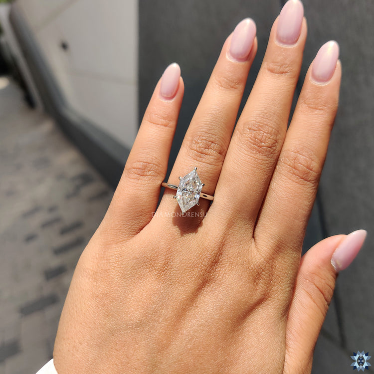 Solitaire white gold ring with Dutch marquise Moissanite and 6 claw prong setting.
