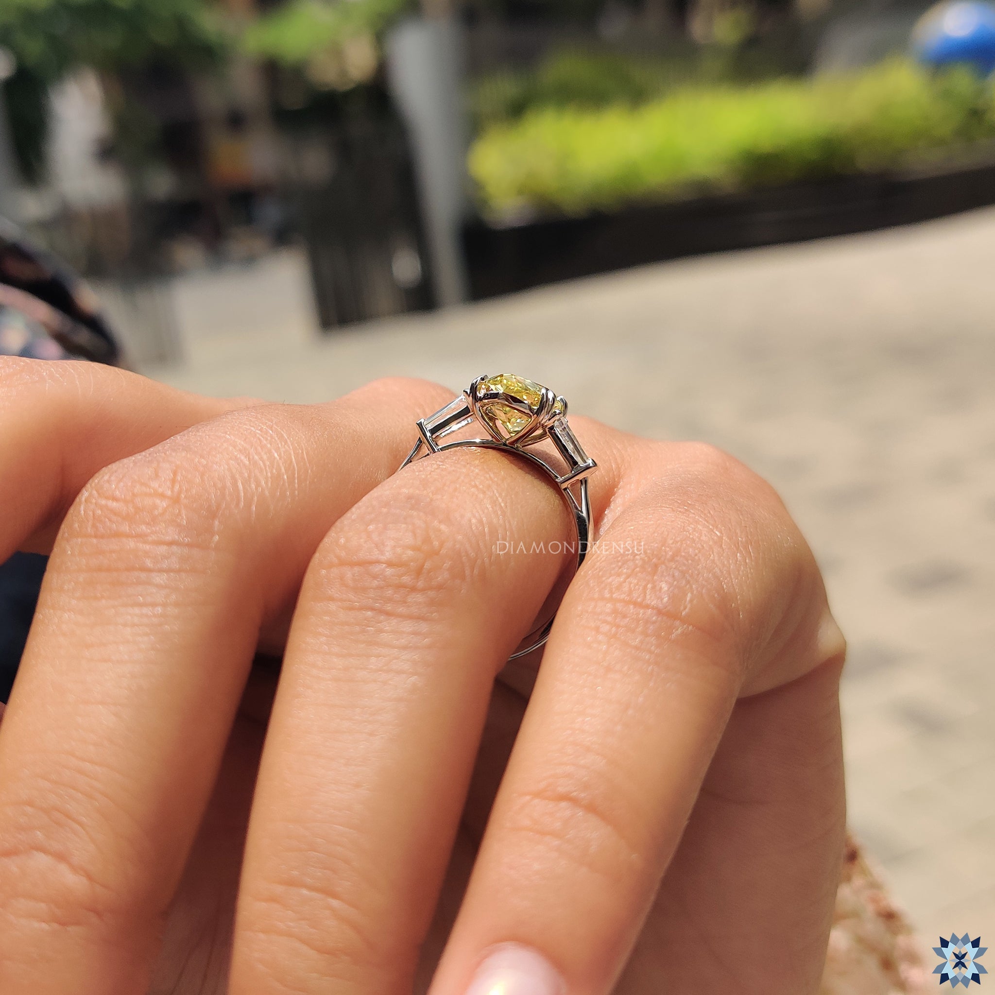 UK engagement ring with pear shaped canary Moissanite and elegant baguette accents.
