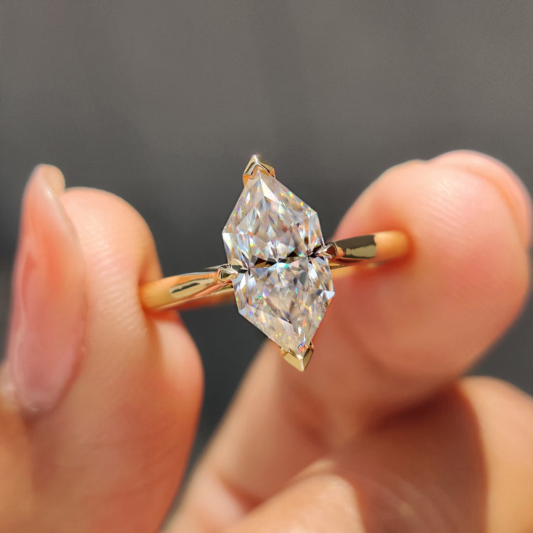 Dutch marquise engagement ring with V and claw prong setting in yellow gold.
