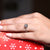 White gold ring featuring a round cut center.
