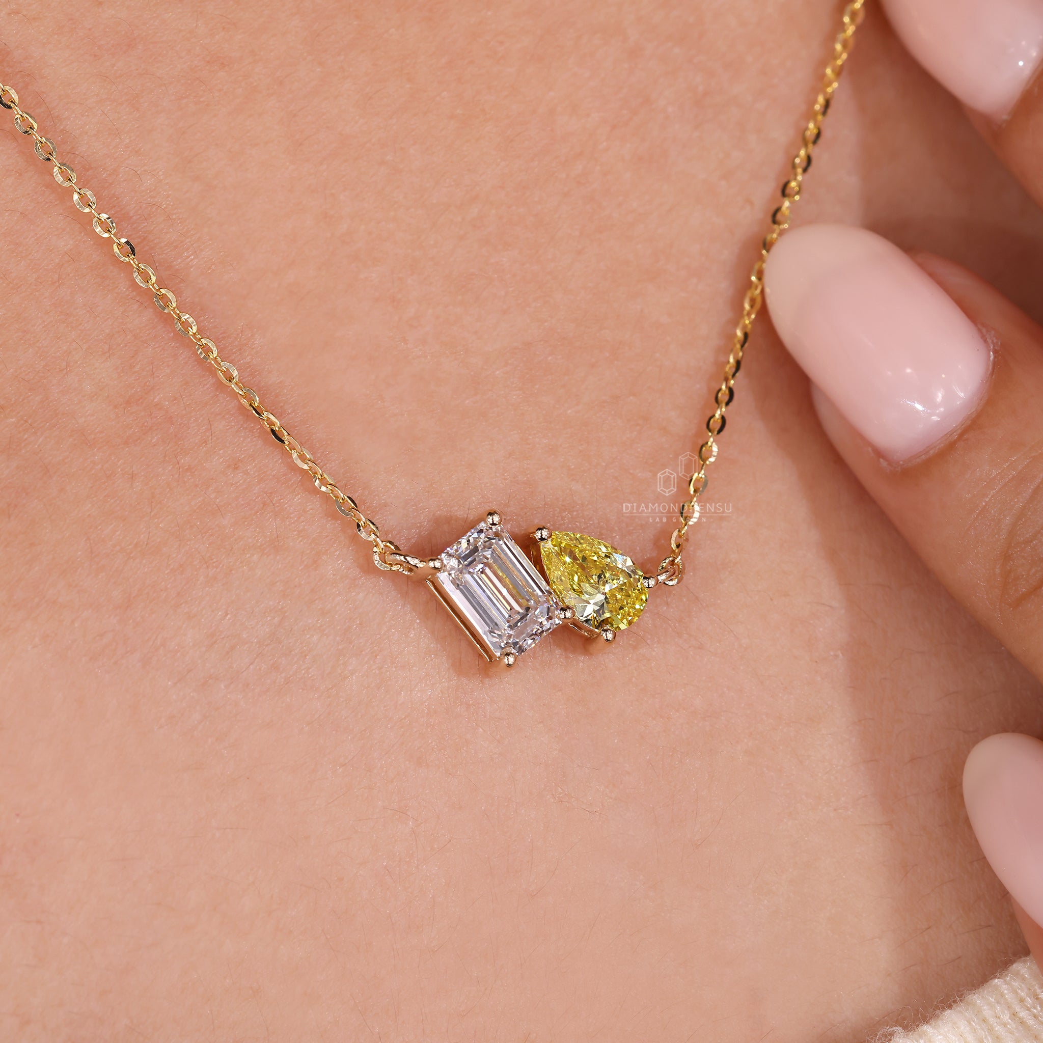 Unique diamond pendant with a shared prong setting and mixed cuts.
