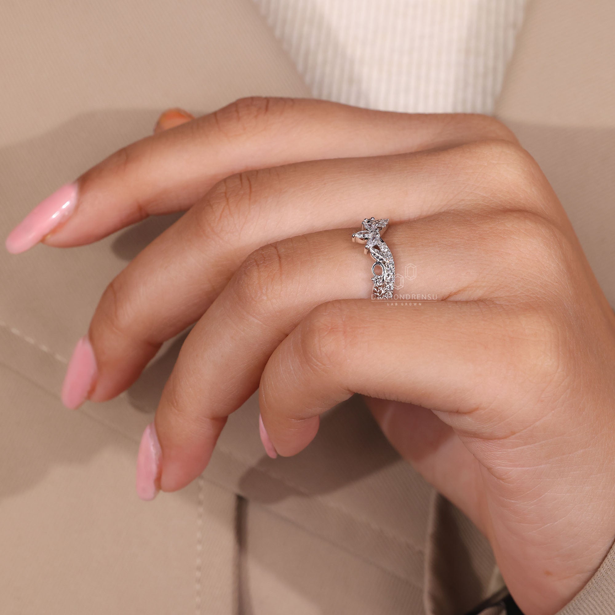 Art deco wedding band featuring marquise accents.
