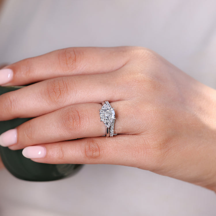 Handmade bridal set featuring tapered shank ring and curved wedding band.
