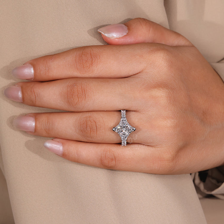 UK engagement ring with trapezoid and princess accents.
