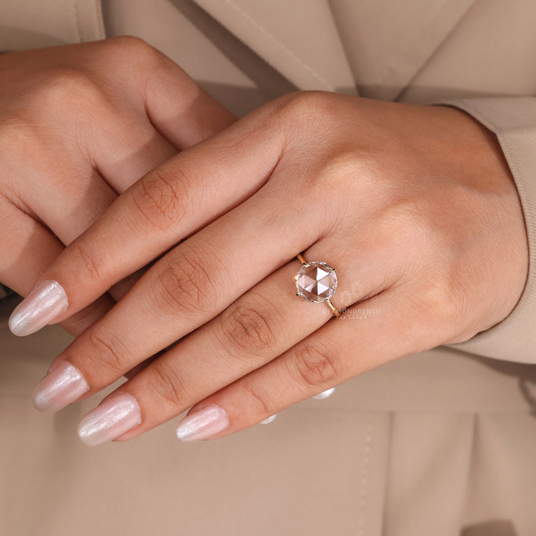 Compass prong setting adds support to the diamond.
