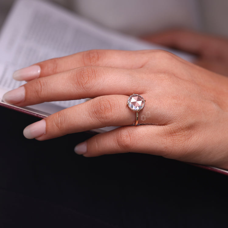 Hidden halo diamond ring with open gallery design.
